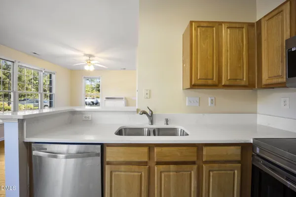 a kitchen with a sink and a window