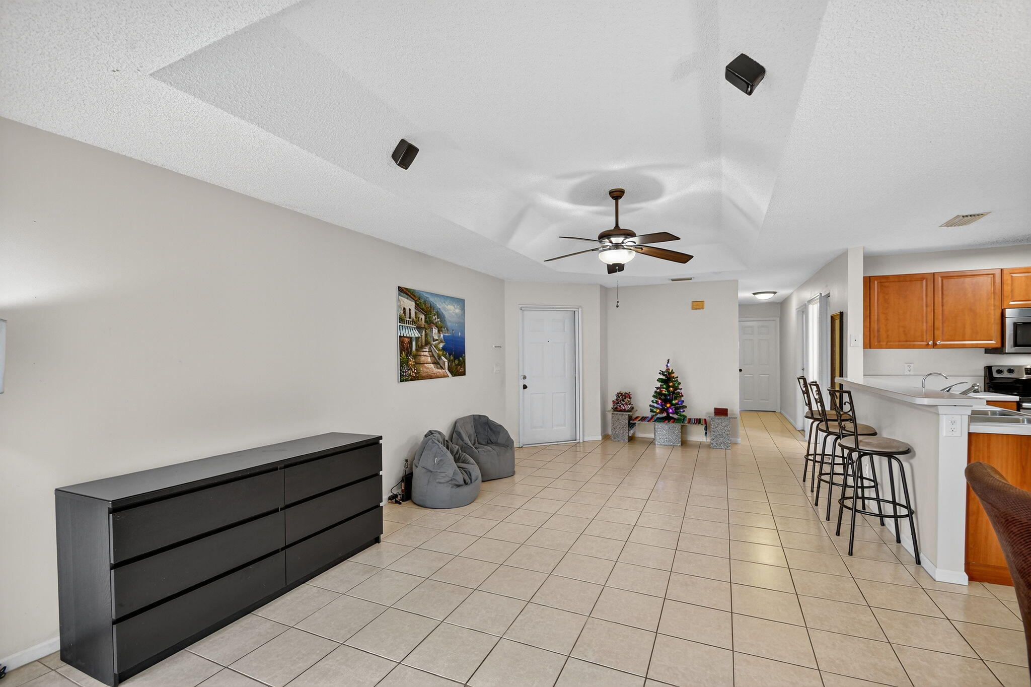 3386 Commodore Court West Palm Beach, FL 33411 - Photo 14 of 79 a view of a livingroom with furniture and a ceiling fan