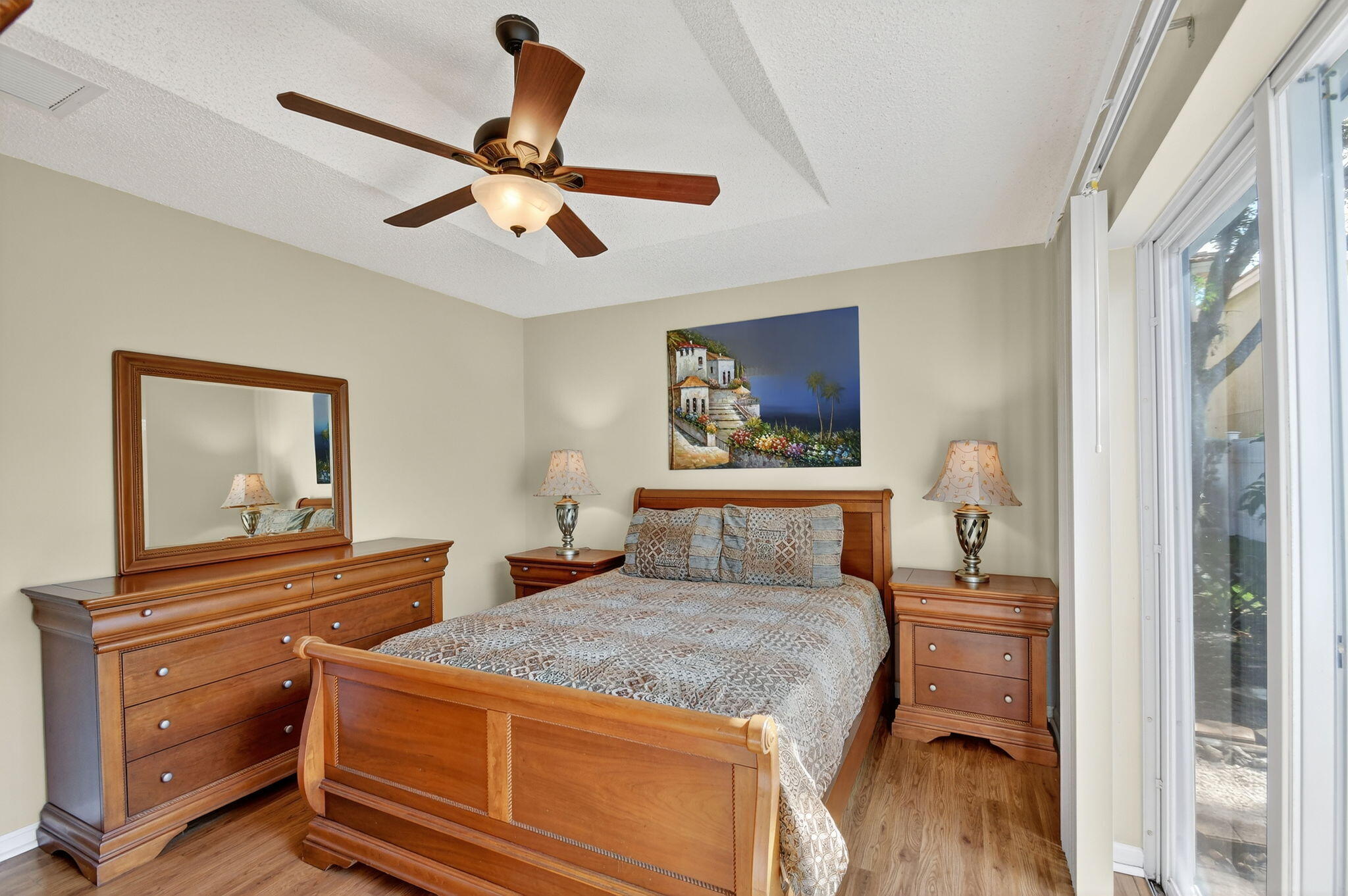 3386 Commodore Court West Palm Beach, FL 33411 - Photo 18 of 79 a bedroom with a bed and a dresser