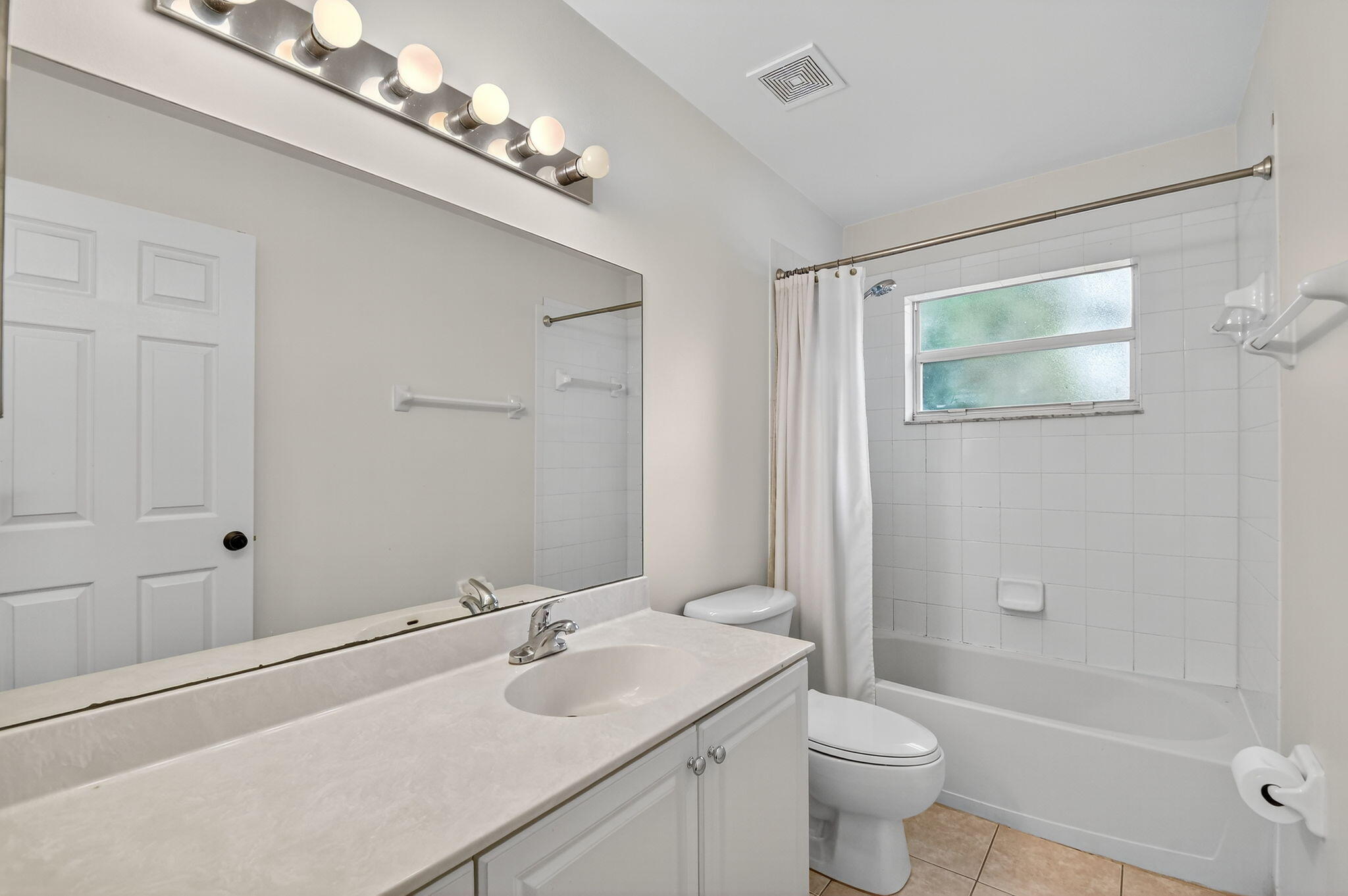 3386 Commodore Court West Palm Beach, FL 33411 - Photo 20 of 79 a bathroom with a sink a toilet and shower