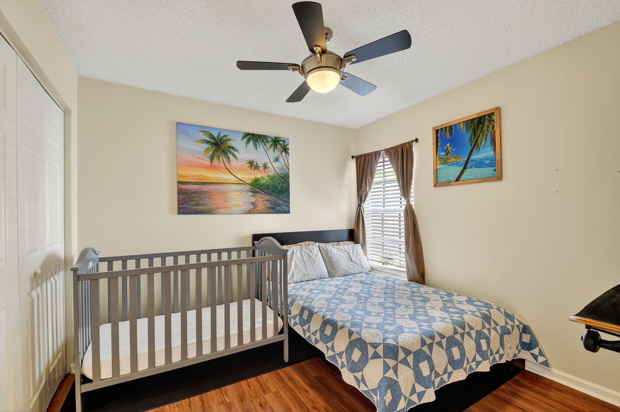 3386 Commodore Court West Palm Beach, FL 33411 - Photo 24 of 79 a bedroom with a bed and a painting on the wall