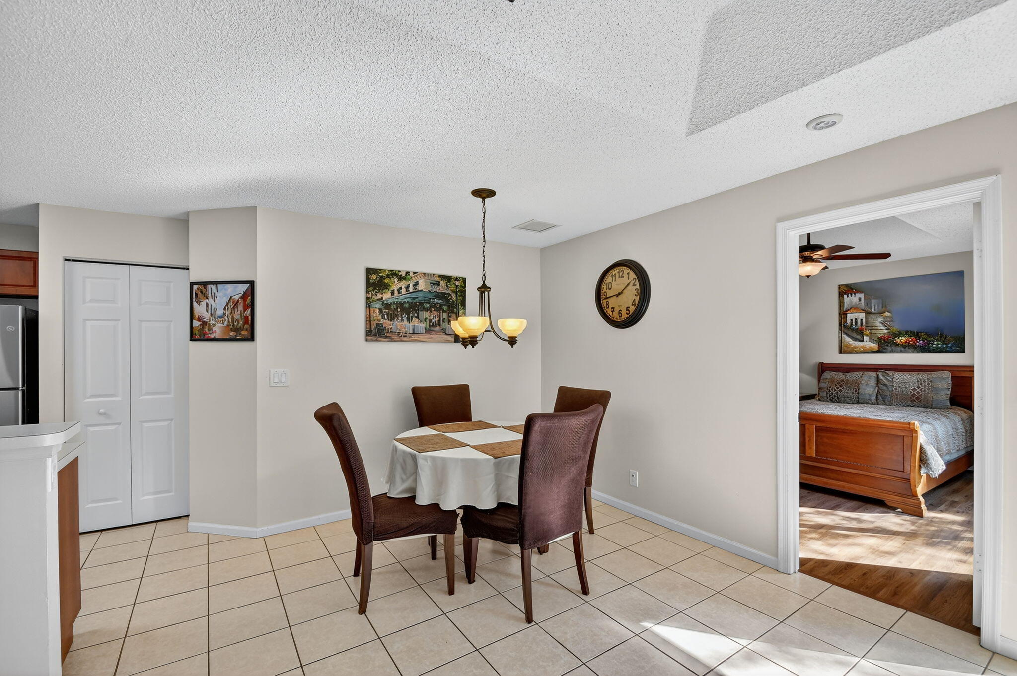 3386 Commodore Court West Palm Beach, FL 33411 - Photo 30 of 79 a dining room with furniture and a large mirror
