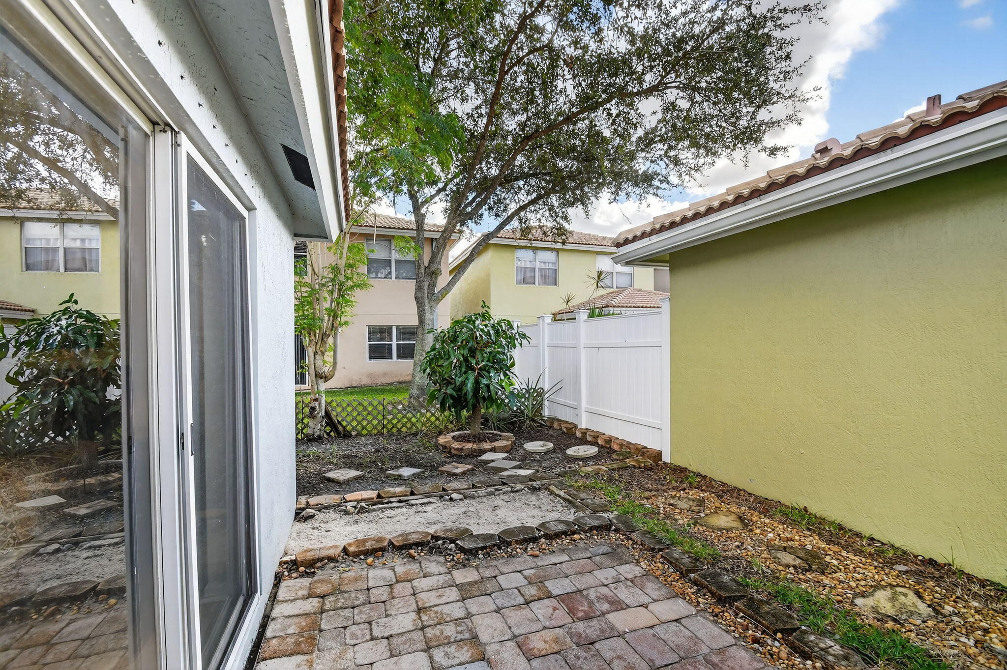 3386 Commodore Court West Palm Beach, FL 33411 - Photo 32 of 79 a view of a backyard with plants and large tree