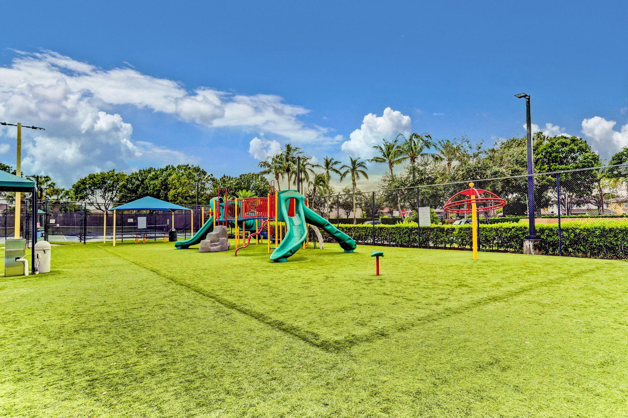 3386 Commodore Court West Palm Beach, FL 33411 - Photo 50 of 79 a view of a house with a yard and potted plants
