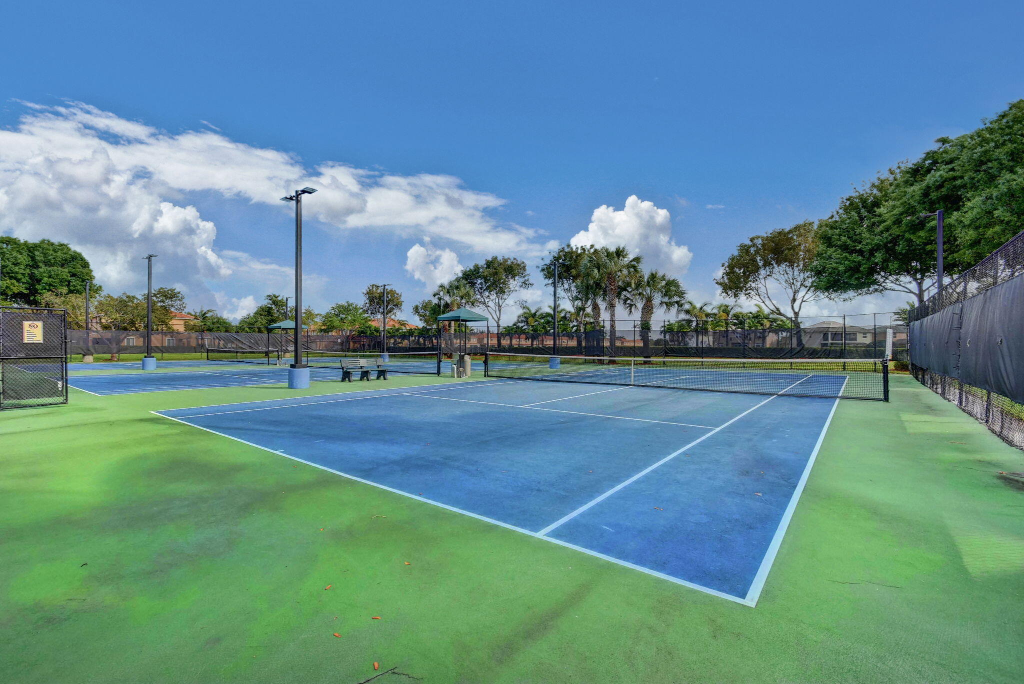 3386 Commodore Court West Palm Beach, FL 33411 - Photo 51 of 79 a view of a tennis court