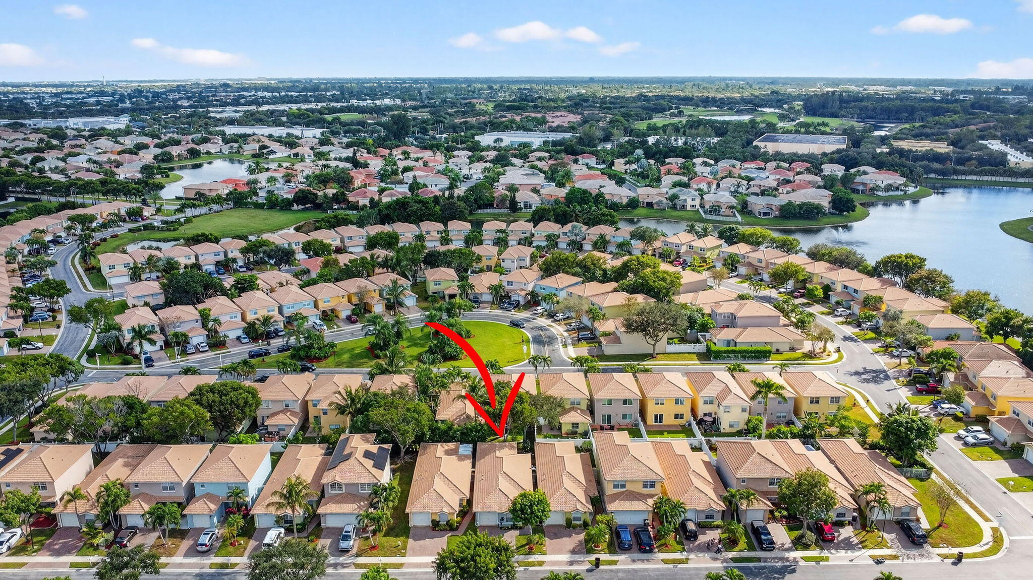 3386 Commodore Court West Palm Beach, FL 33411 - Photo 65 of 79 an aerial view of residential building and lake
