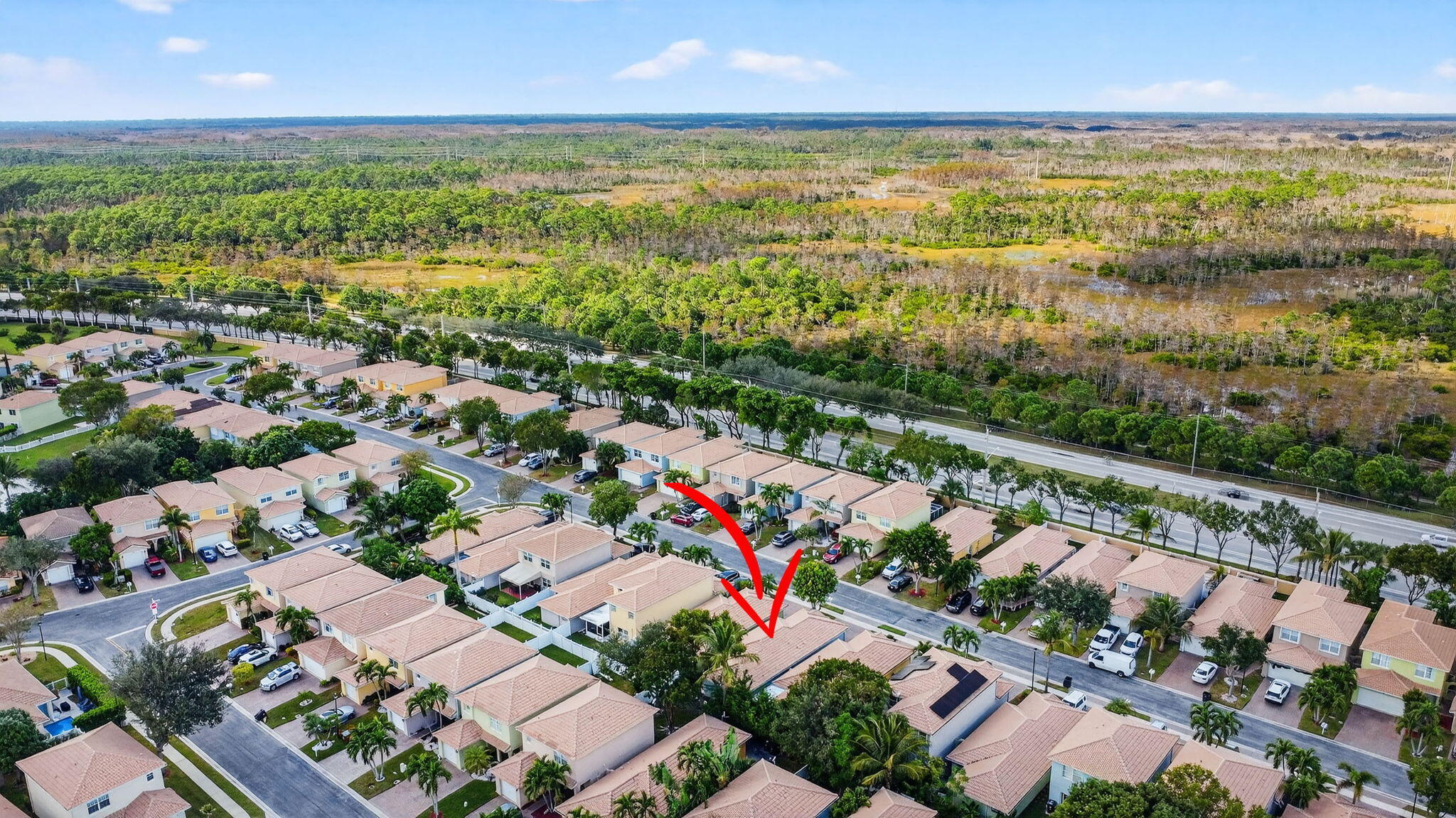 3386 Commodore Court West Palm Beach, FL 33411 - Photo 70 of 79 an aerial view of residential houses with outdoor space and river