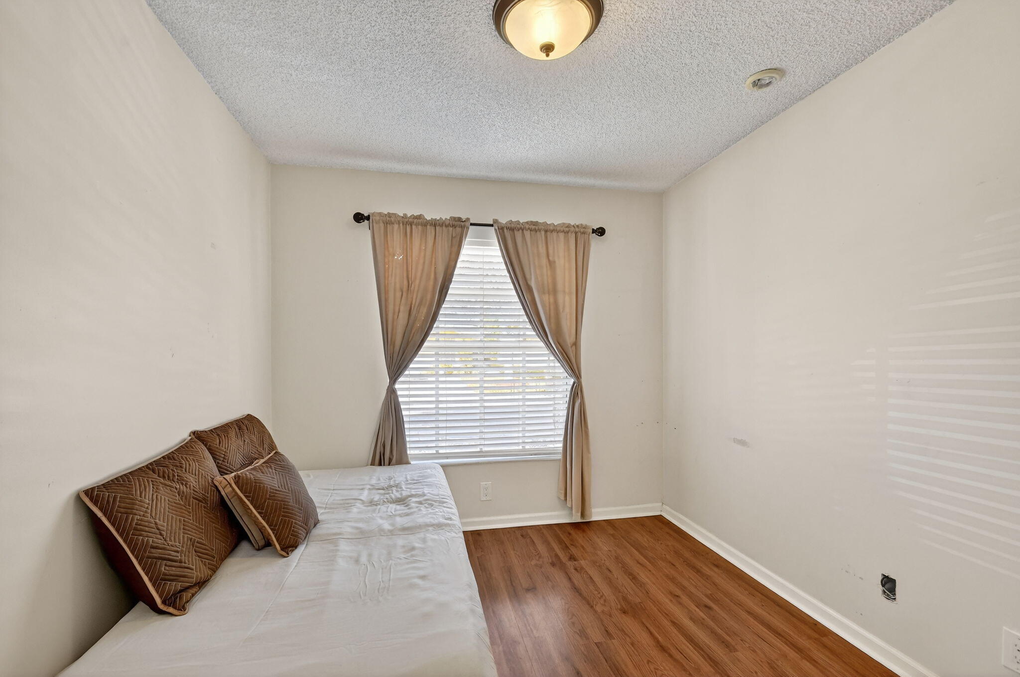 3386 Commodore Court West Palm Beach, FL 33411 - Photo 77 of 79 an empty room with wooden floor and windows