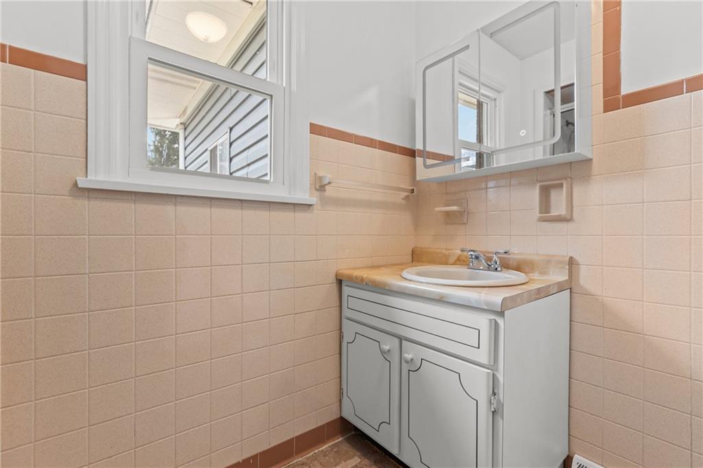 1300 Main Street Bentleyville, PA 15314 - Photo 18 of 36 a bathroom with a sink a vanity and a window