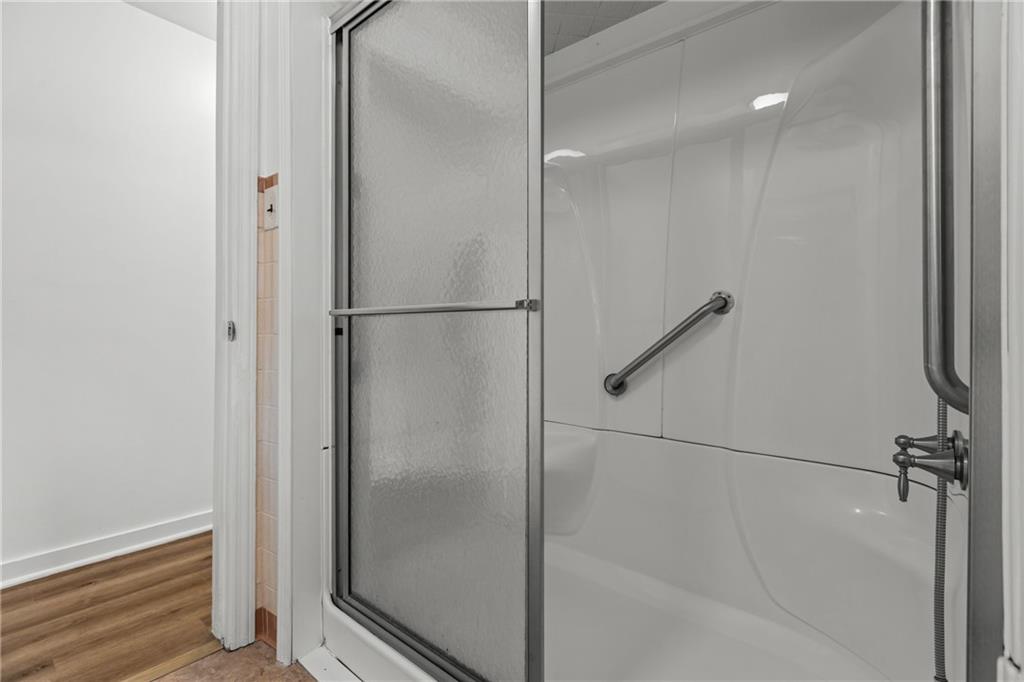 1300 Main Street Bentleyville, PA 15314 - Photo 19 of 36 a bathroom with a glass shower door