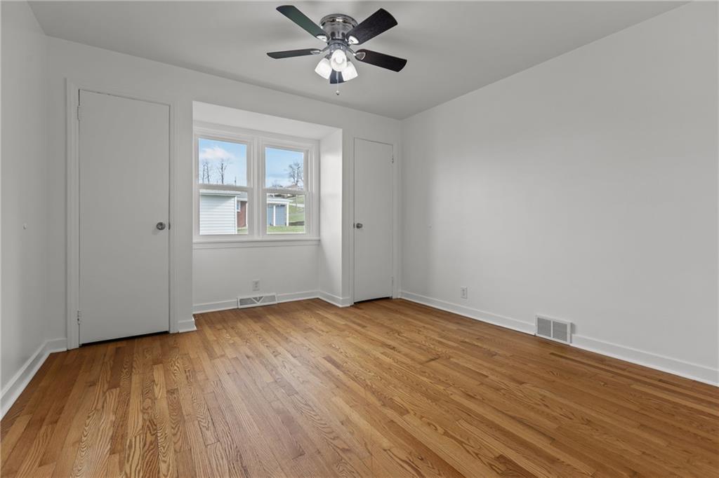 1300 Main Street Bentleyville, PA 15314 - Photo 22 of 36 a view of empty room with wooden floor and fan