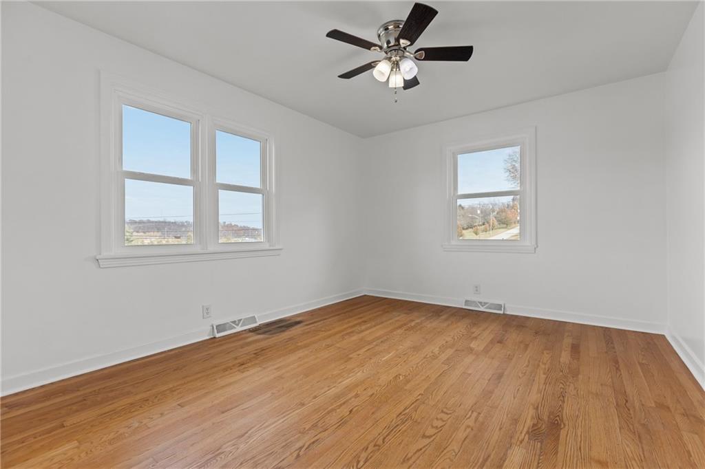 1300 Main Street Bentleyville, PA 15314 - Photo 23 of 36 a view of empty room with wooden floor and fan