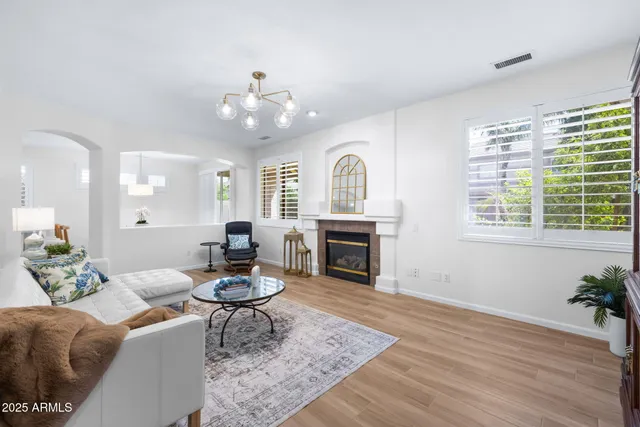 a living room with furniture and a fireplace