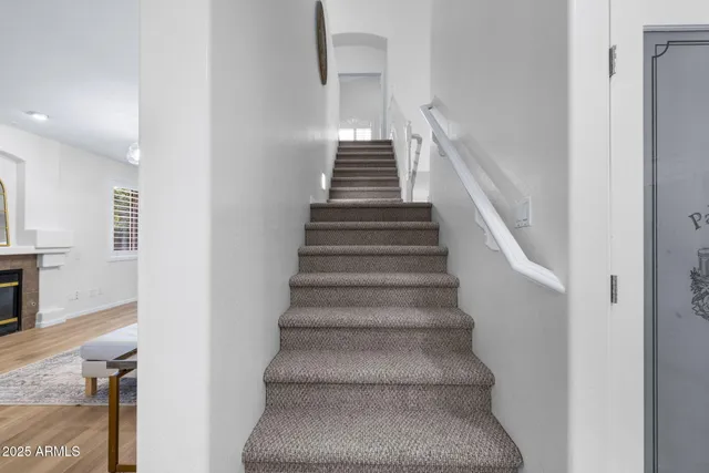 a living room with furniture or couch and a fireplace