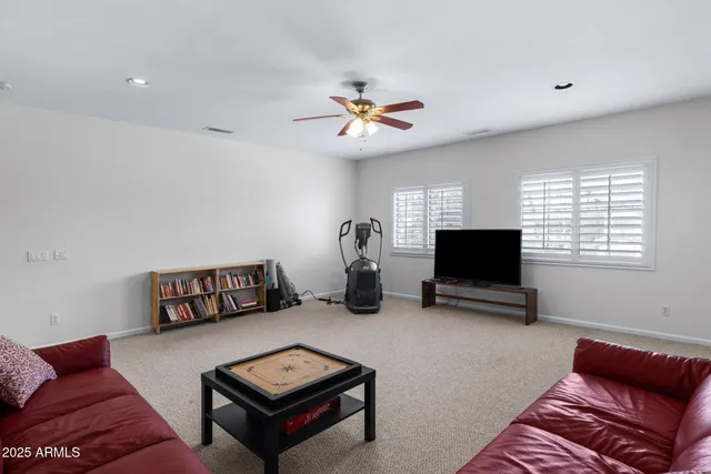 a view of a livingroom with furniture and a window