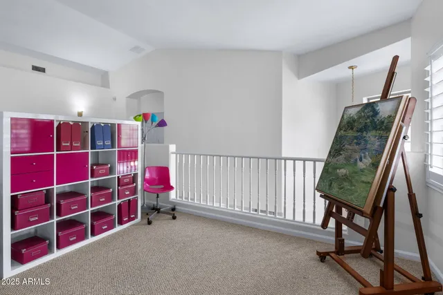 a bedroom with a bed dresser and a window