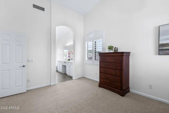 a bathroom with a tub shower and sink