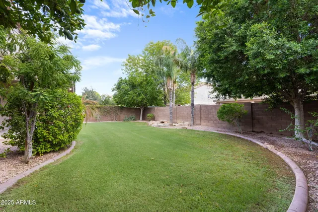 a view of a lake with houses in the background