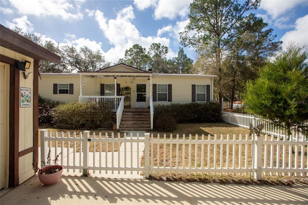 5711 Caribbean Circle Keystone Heights, FL 32656 - Photo 1 of 61 a house view with a garden space