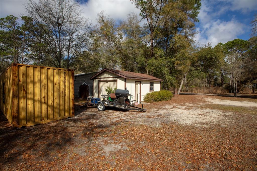 5711 Caribbean Circle Keystone Heights, FL 32656 - Photo 15 of 61 a view of a house with backyard and sitting area