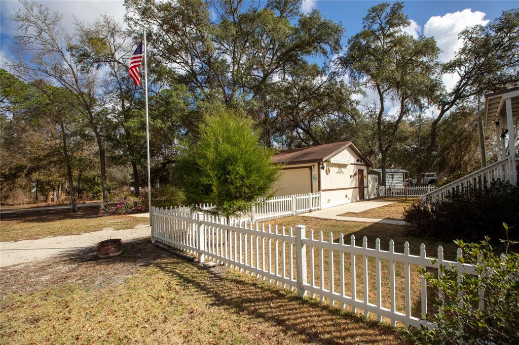 5711 Caribbean Circle Keystone Heights, FL 32656 - Photo 16 of 61 a view of a house with a small yard and trees