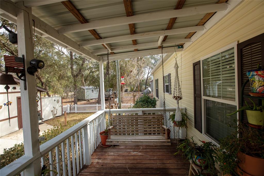 5711 Caribbean Circle Keystone Heights, FL 32656 - Photo 17 of 61 a view of a porch with wooden floor