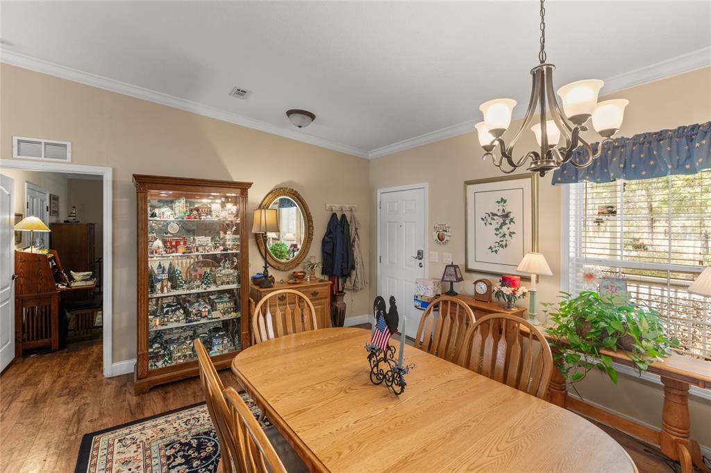 5711 Caribbean Circle Keystone Heights, FL 32656 - Photo 21 of 61 a view of a dining room with furniture