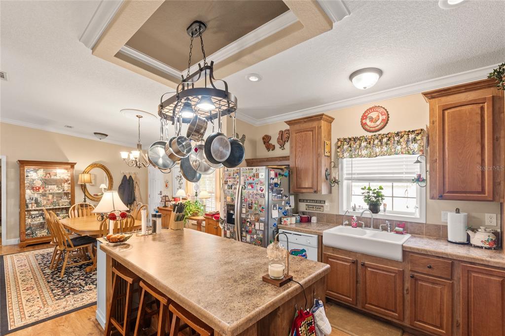 5711 Caribbean Circle Keystone Heights, FL 32656 - Photo 27 of 61 a kitchen with stainless steel appliances granite countertop a stove and a sink