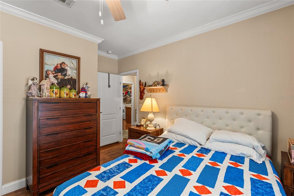 5711 Caribbean Circle Keystone Heights, FL 32656 - Photo 33 of 61 a bedroom with a bed and wooden floor