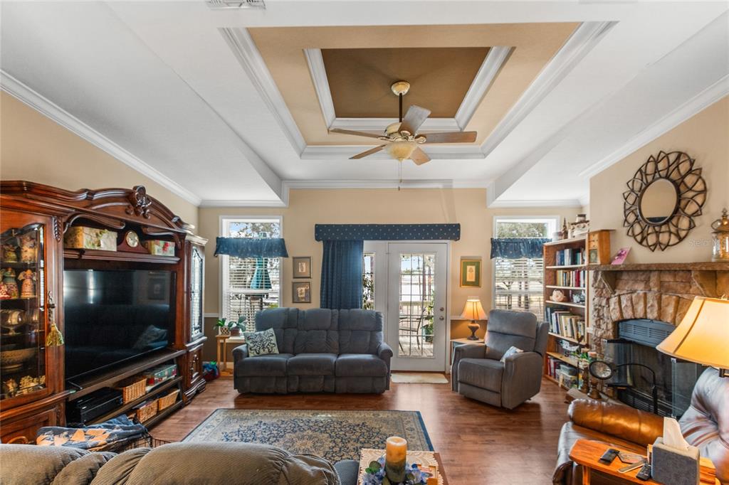 5711 Caribbean Circle Keystone Heights, FL 32656 - Photo 35 of 61 a living room with furniture and a flat screen tv