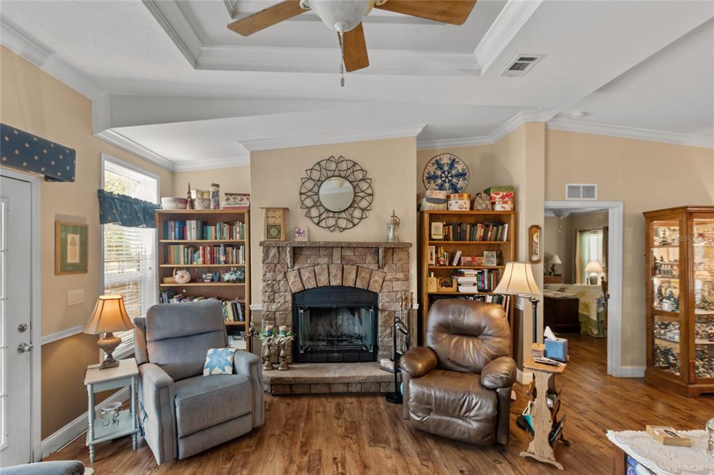 5711 Caribbean Circle Keystone Heights, FL 32656 - Photo 37 of 61 a living room with furniture and a fireplace