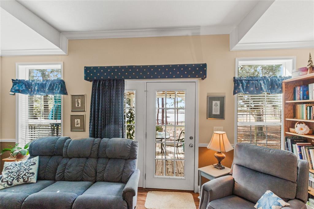 5711 Caribbean Circle Keystone Heights, FL 32656 - Photo 38 of 61 a living room with furniture and a large window