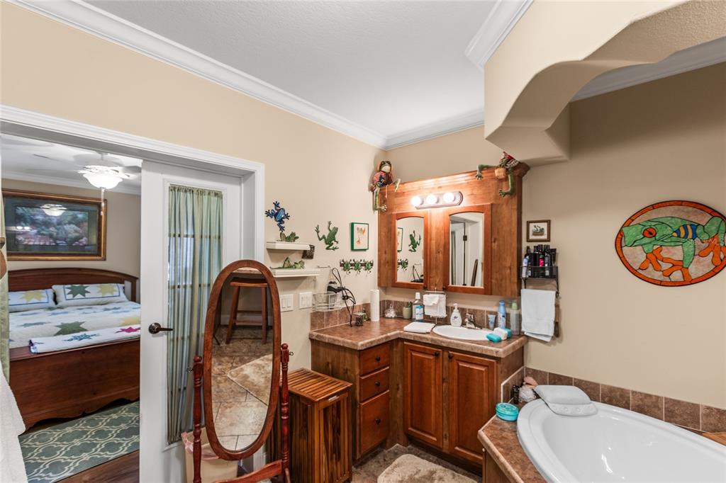 5711 Caribbean Circle Keystone Heights, FL 32656 - Photo 44 of 61 a bathroom with a sink mirror vanity and toilet