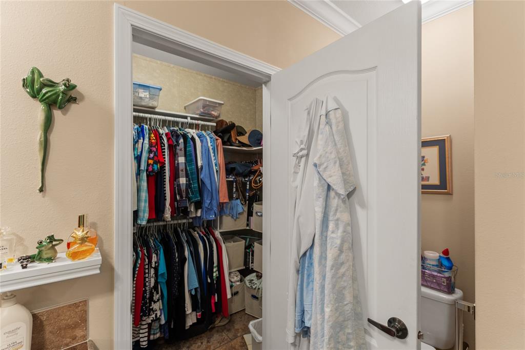 5711 Caribbean Circle Keystone Heights, FL 32656 - Photo 46 of 61 a view of walk in closet with clothes and shoes