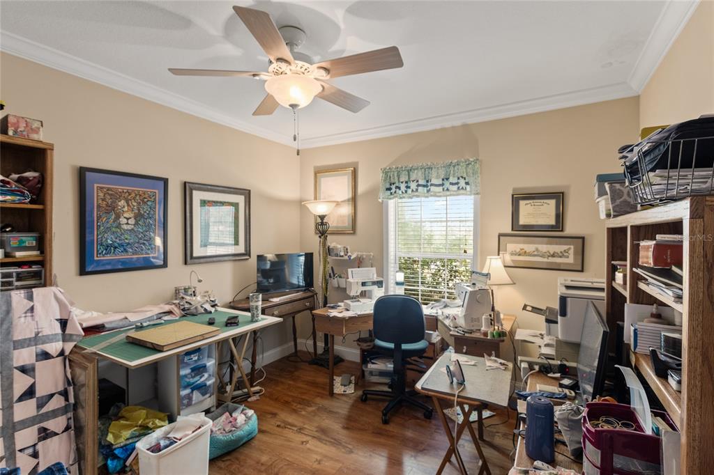 5711 Caribbean Circle Keystone Heights, FL 32656 - Photo 50 of 61 a view of a workspace with furniture and a livingroom