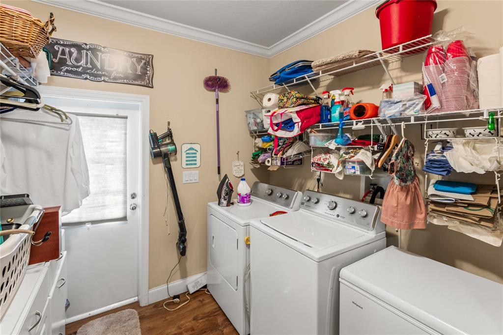 5711 Caribbean Circle Keystone Heights, FL 32656 - Photo 51 of 61 a storage room with washer and dryer