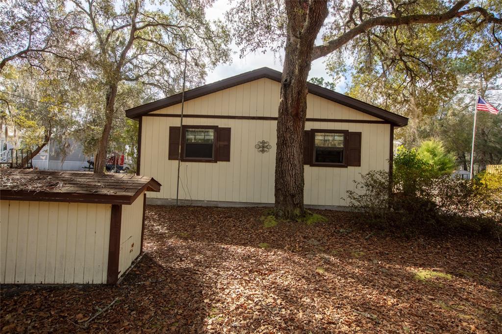 5711 Caribbean Circle Keystone Heights, FL 32656 - Photo 53 of 61 a view of a house with a yard and tree s
