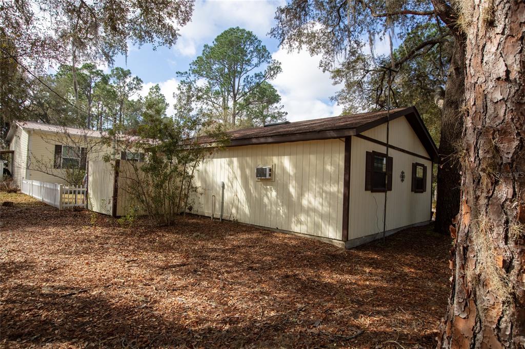 5711 Caribbean Circle Keystone Heights, FL 32656 - Photo 54 of 61 a front view of a house with garden