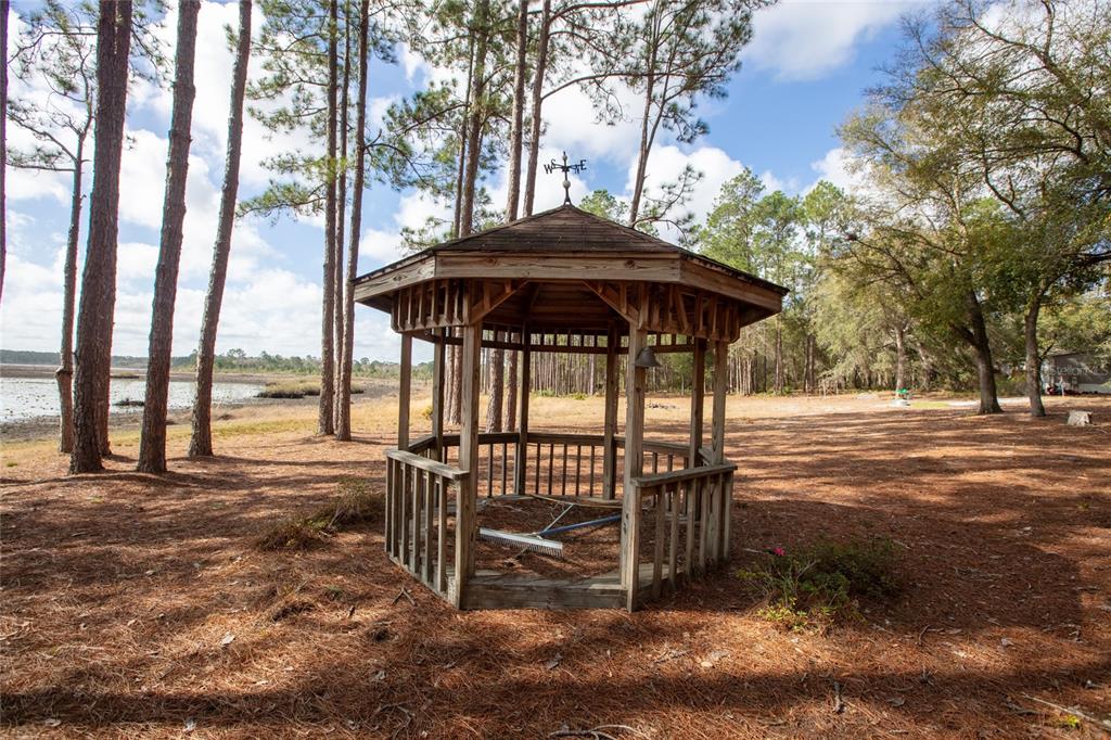 5711 Caribbean Circle Keystone Heights, FL 32656 - Photo 61 of 61 a view of a patio with furniture and backyard