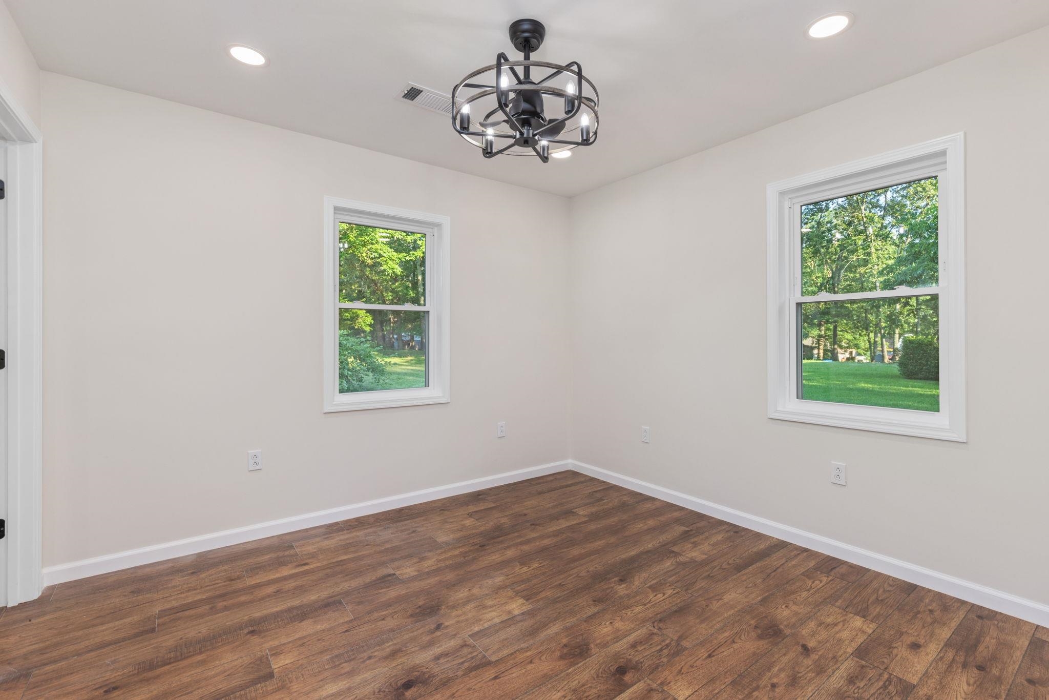 17 County Road 233 Corinth, MS 38834 - Photo 13 of 40 Unfurnished room featuring a chandelier, recessed lighting, and dark wood-type flooring