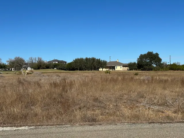 a front view of house with yard and outdoor seating