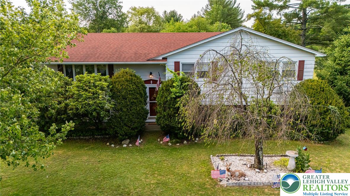 678 Interchange Road Kresgeville, PA 18333 - Photo 11 of 45 A classic ranch-style residence nestled among mature greenery with a manicured front lawn.