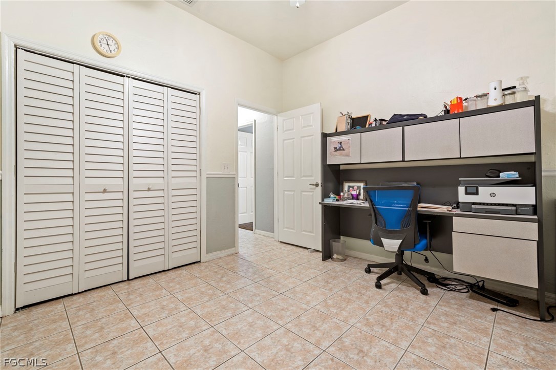 2724 3rd Street Southwest Lehigh Acres, FL 33976 - Photo 15 of 26 a view of a workspace with furniture