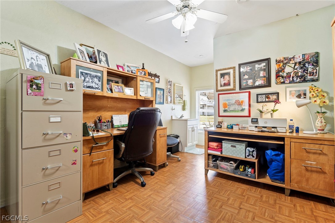 2724 3rd Street Southwest Lehigh Acres, FL 33976 - Photo 16 of 26 a view of a workspace with furniture and toys