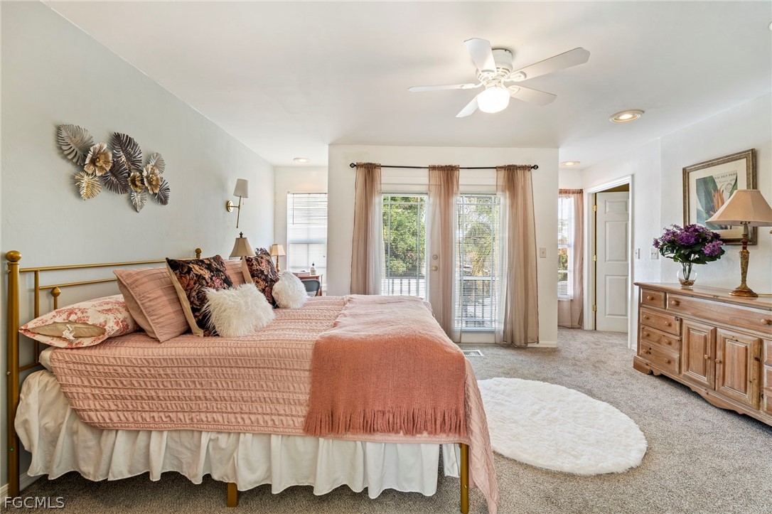 2724 3rd Street Southwest Lehigh Acres, FL 33976 - Photo 20 of 26 a living room with a bed furniture and a large window