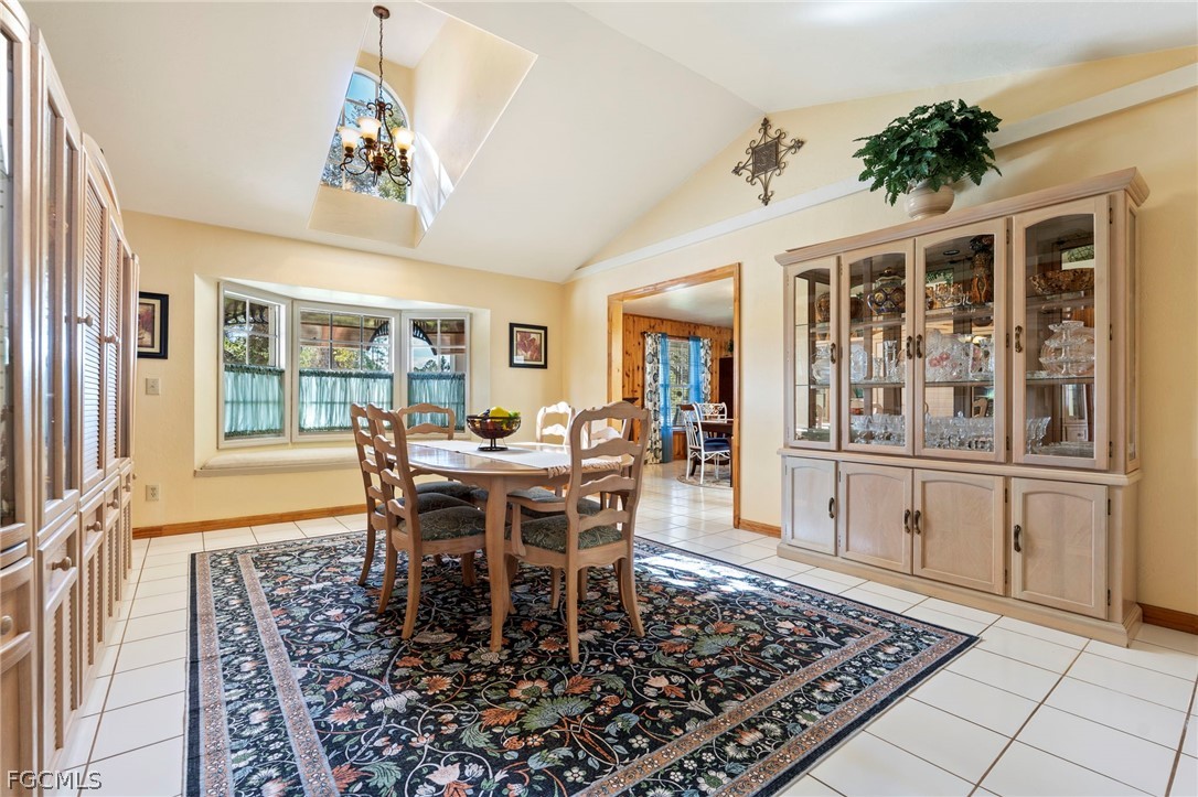 2724 3rd Street Southwest Lehigh Acres, FL 33976 - Photo 6 of 26 a view of a dining room with furniture window and wooden floor