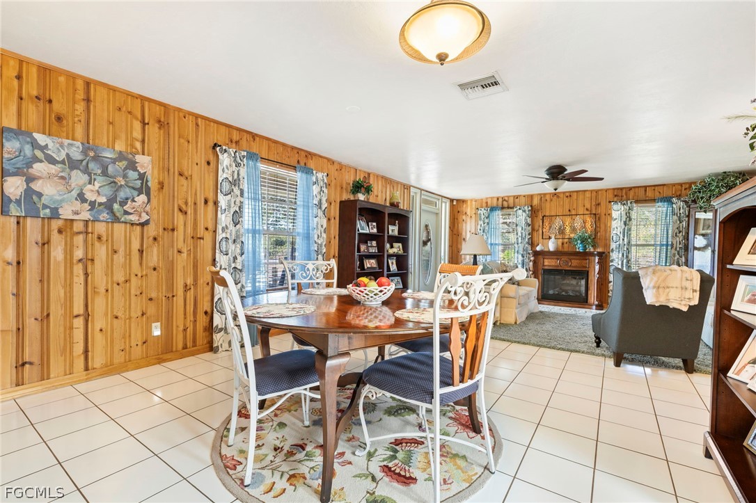 2724 3rd Street Southwest Lehigh Acres, FL 33976 - Photo 7 of 26 a view of a dining room with furniture window and outside view