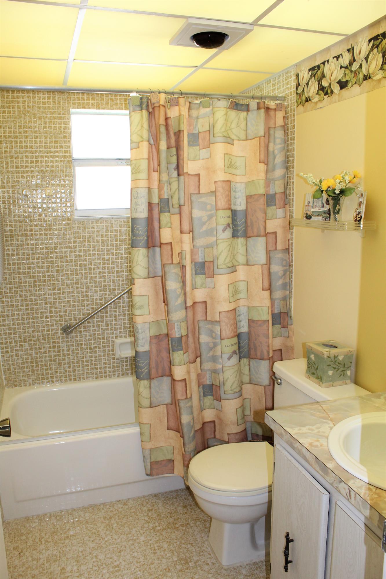 956 Normandy Trail Delray Beach, FL 33484 - Photo 8 of 15 Bathroom with Tub and Shower