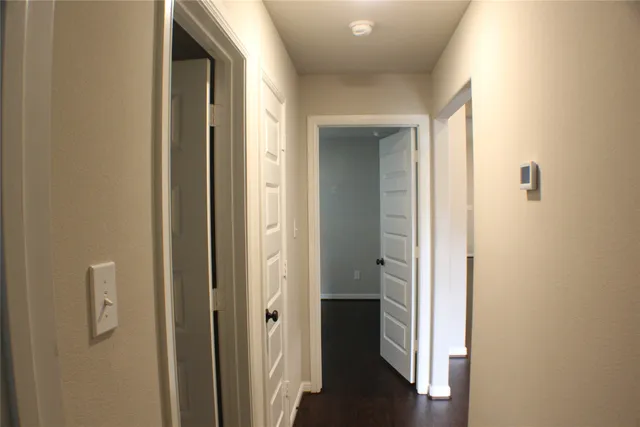 a view of a bathroom from the hallway