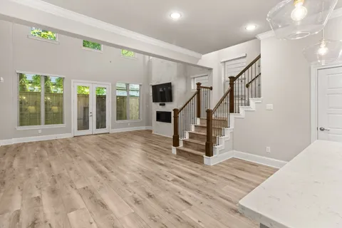 a view of an entryway with wooden floor